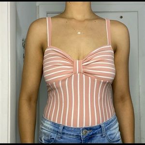 White and pink bodysuit. Like new